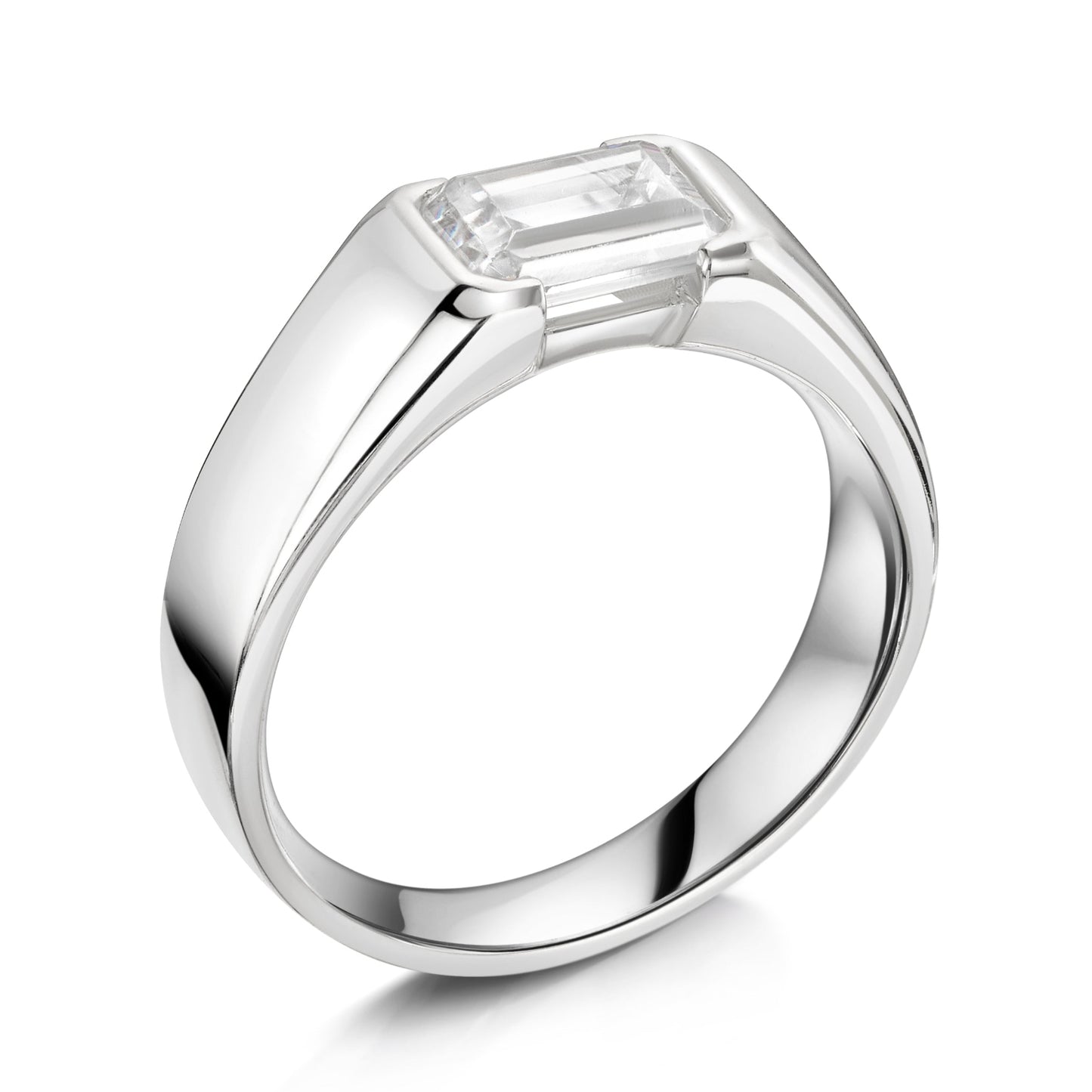 Chunky platinum emerald cut diamond east west diamond ring - angled on a white background