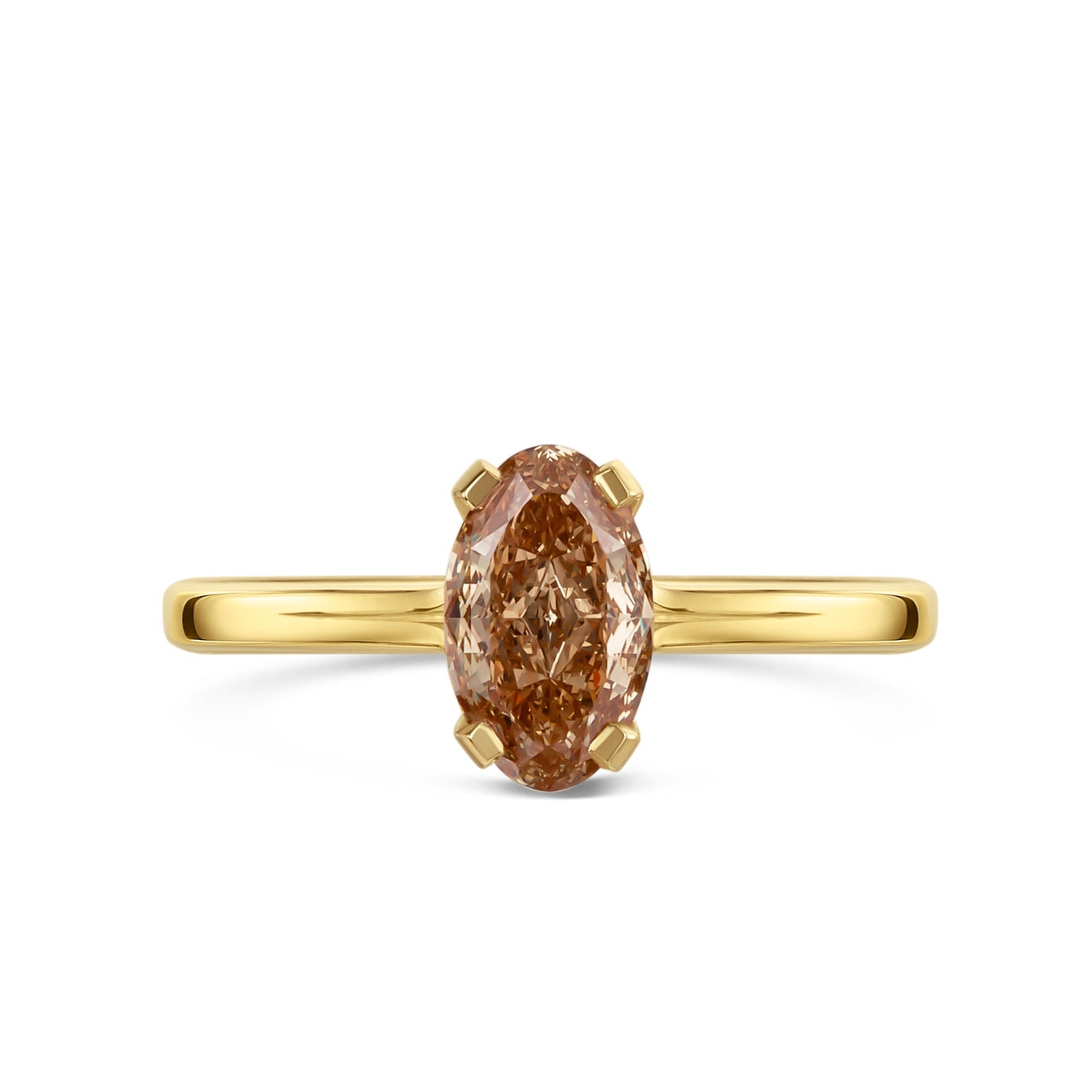 Gold ring with a brown oval diamond on a white background
