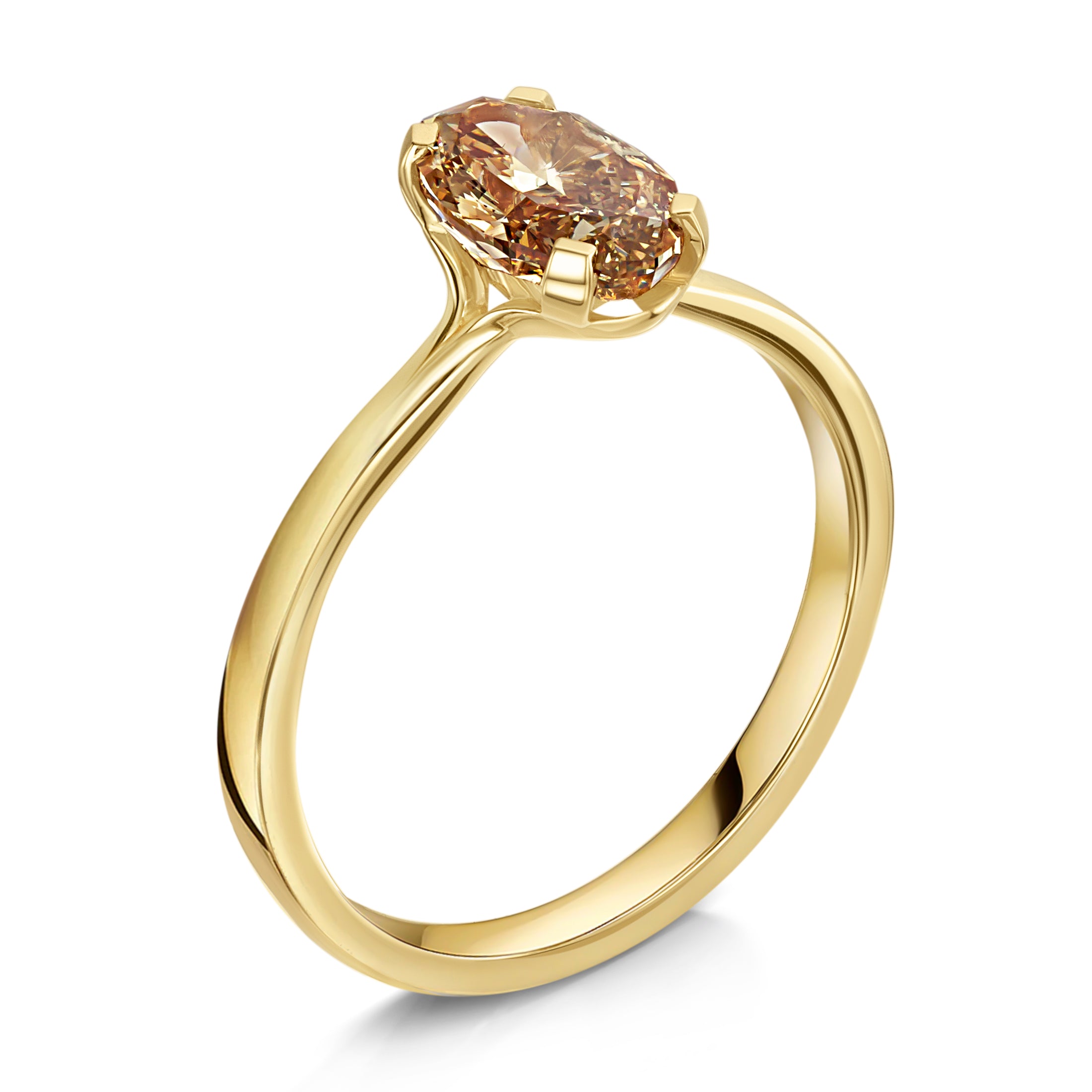 Gold ring with a brown gemstone on a white background