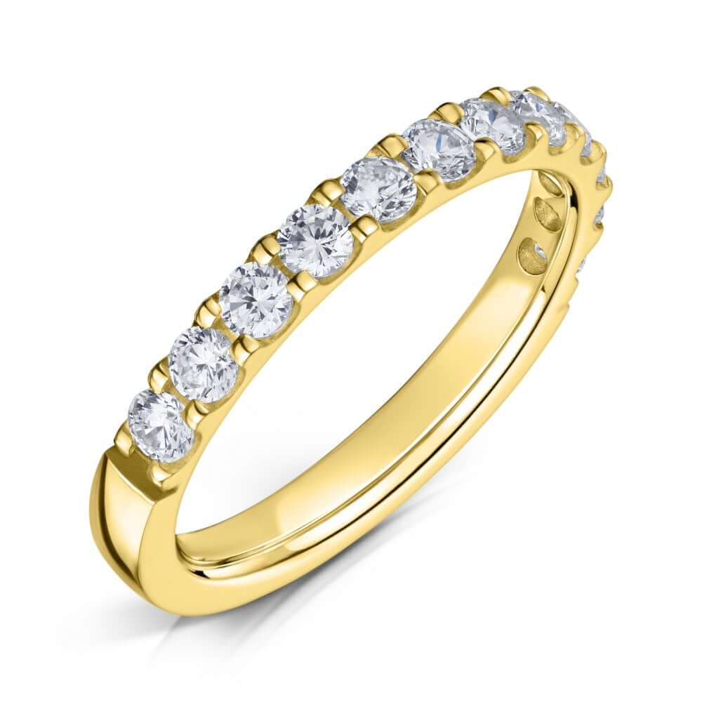 2.5mm claw set yellow gold diamond half eternity ring on a white background