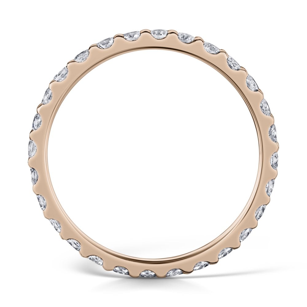 2mm claw set diamond eternity ring in rose gold - side view on a white background