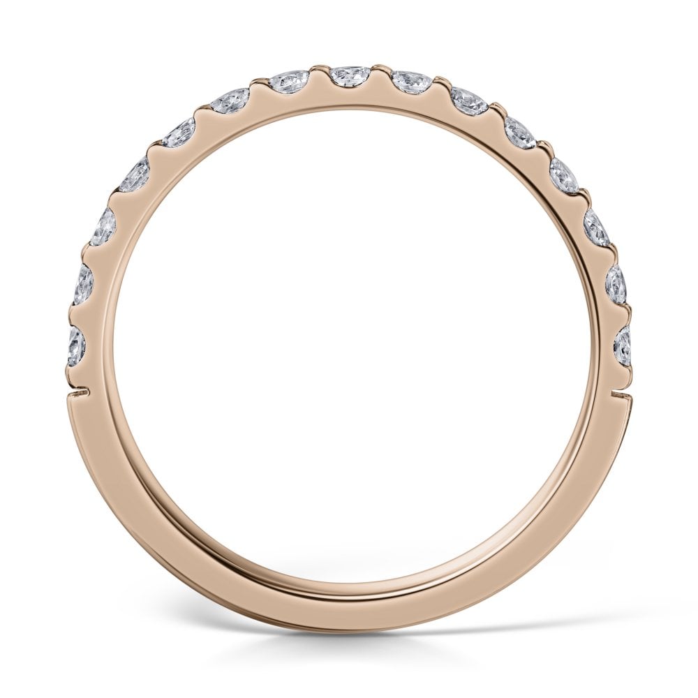 2mm claw set diamond half eternity ring in rose gold - side view on a white background