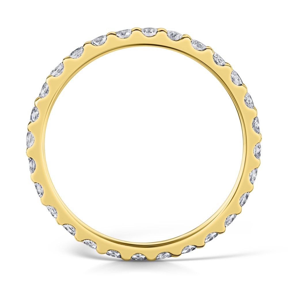 2mm yellow gold claw set diamond eternity ring - side view on a white background