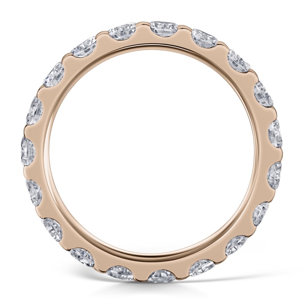 3.0mm Claw Set Diamond Eternity Ring in Rose Gold - side view on a white background
