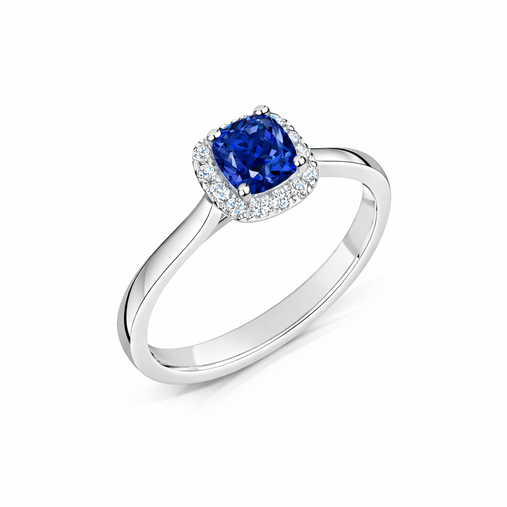 Blue Sapphire Cushion Cut Halo Engagement Ring in Platinum - angled view on a white background
