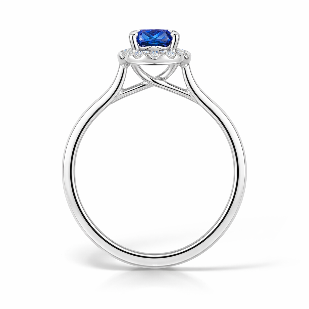 Blue Sapphire Cushion Cut Halo Engagement Ring in Platinum - side view on a white background 