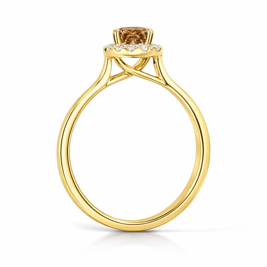 Gold ring with a brown gemstone and smaller diamonds on a white background