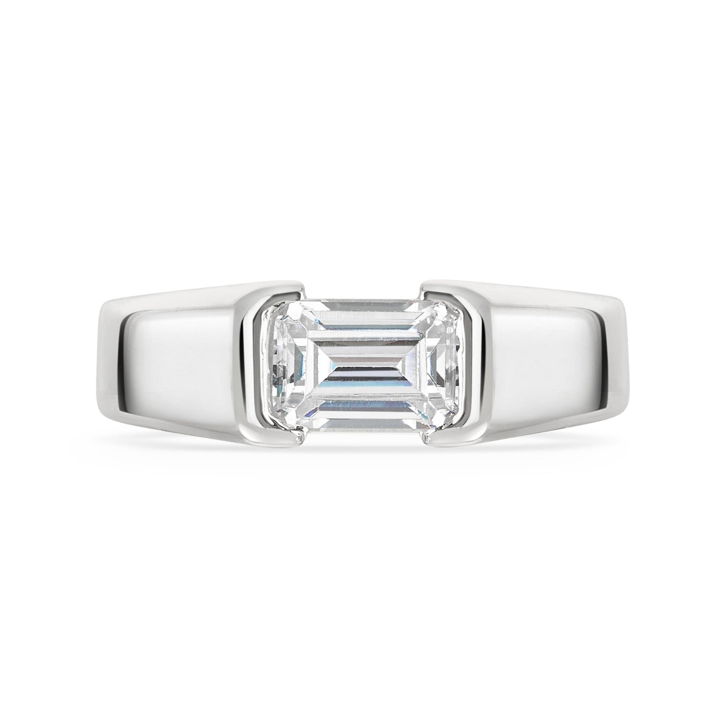 Chunky platinum emerald cut diamond east west diamond ring on a white background