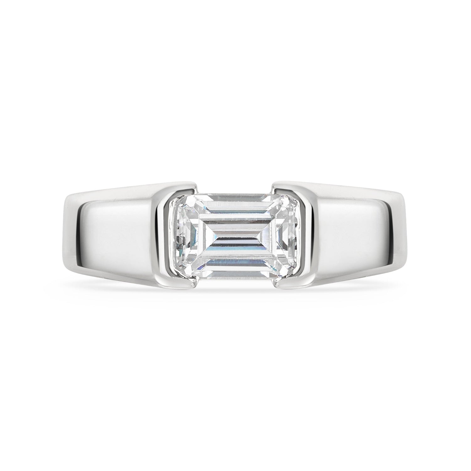 Chunky platinum emerald cut diamond east west diamond ring on a white background