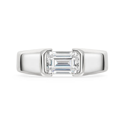 Chunky platinum emerald cut diamond east west diamond ring on a white background