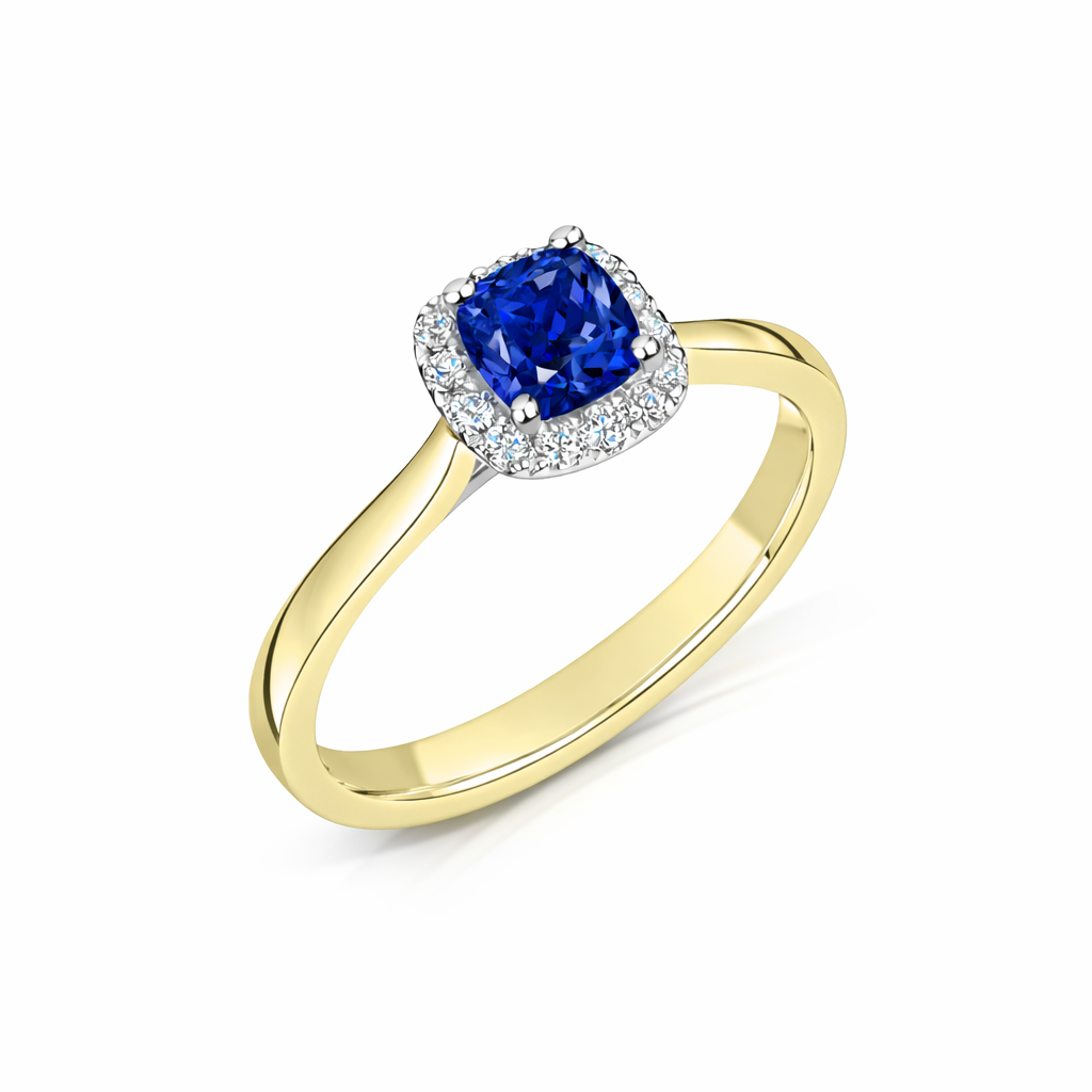 Gold ring with a blue sapphire gemstone on a white background