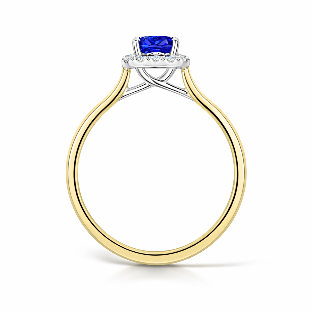 Gold ring with a blue gemstone on a white background