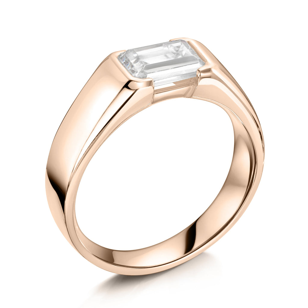 East West Chunky Emerald Cut Diamond Engagement Ring in Rose Gold - angled on a white background