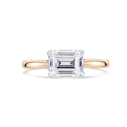 East West Emerald Cut Diamond Engagement Ring in Yellow Gold on white background   