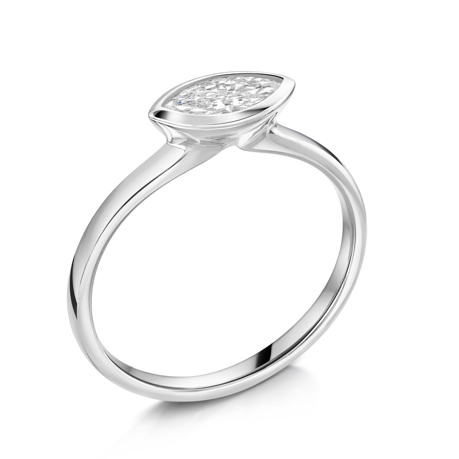 East West Marquise Bezel Set engagement ring in Platinum - angled view on a white background 