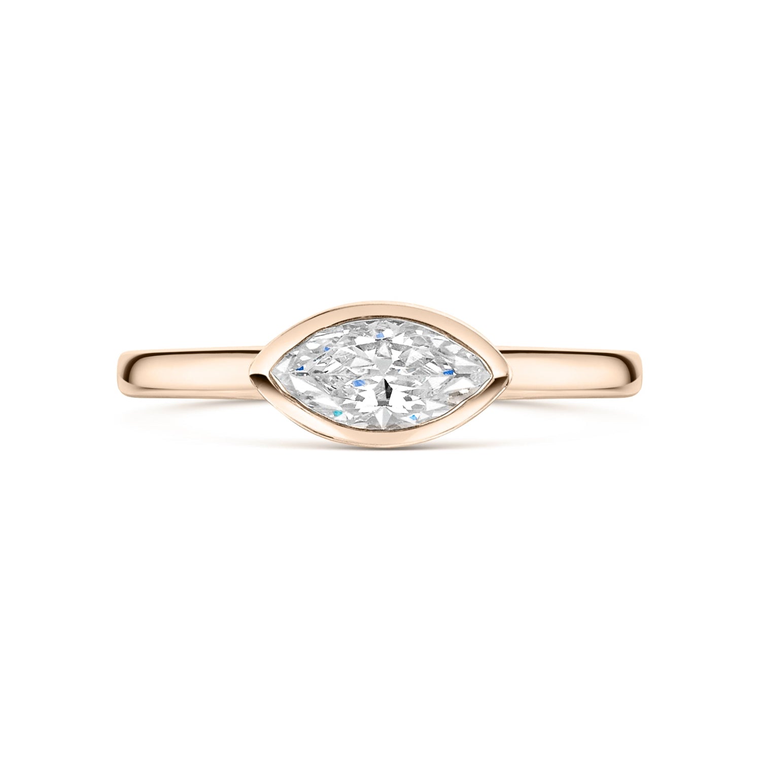 East West Marquise Bezel Set engagement ring in rose gold on a white background 