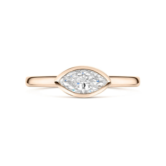 East West Marquise Bezel Set engagement ring in rose gold on a white background 