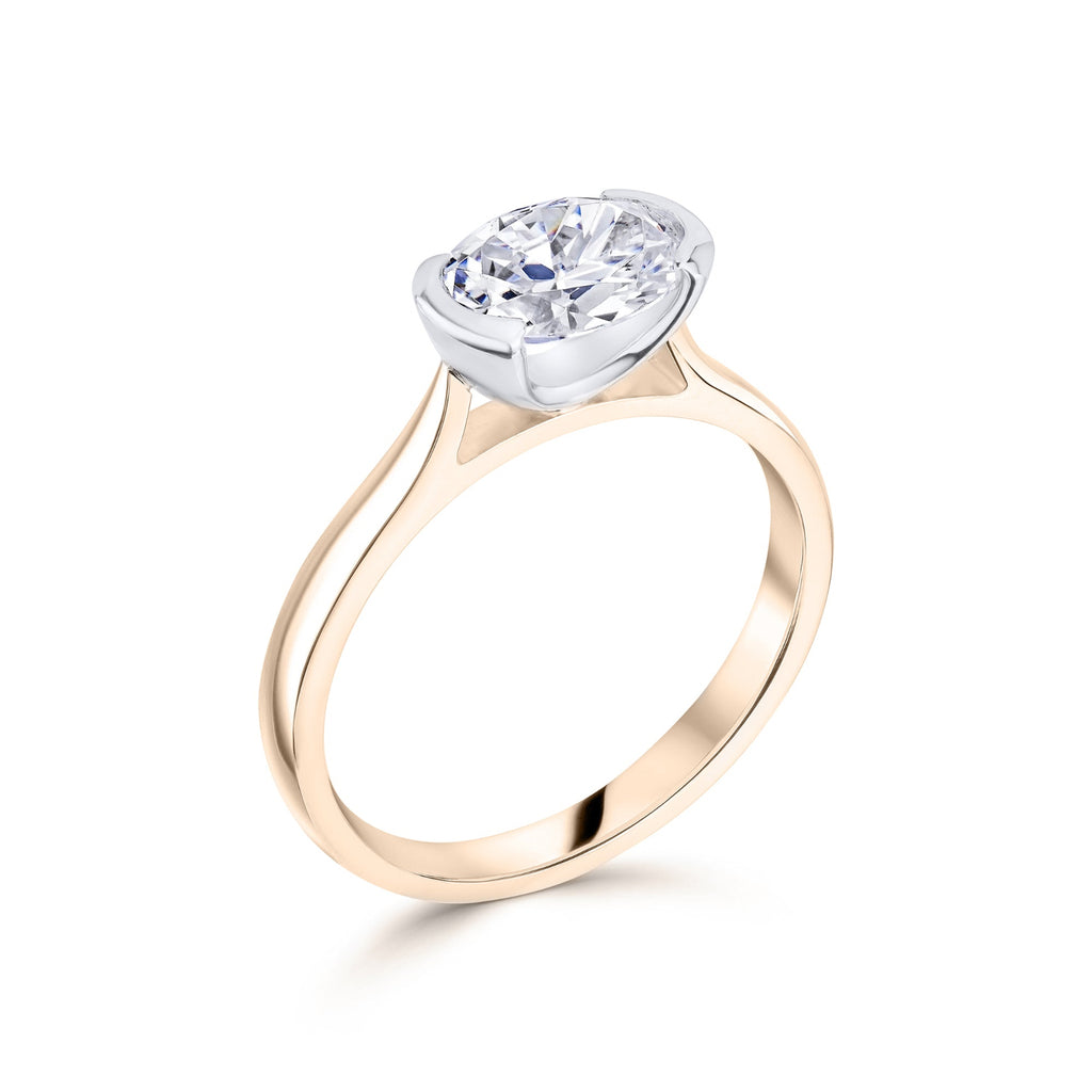 East West Oval Diamond Engagement Ring in Rose Gold with platinum bezel setting on a white background 