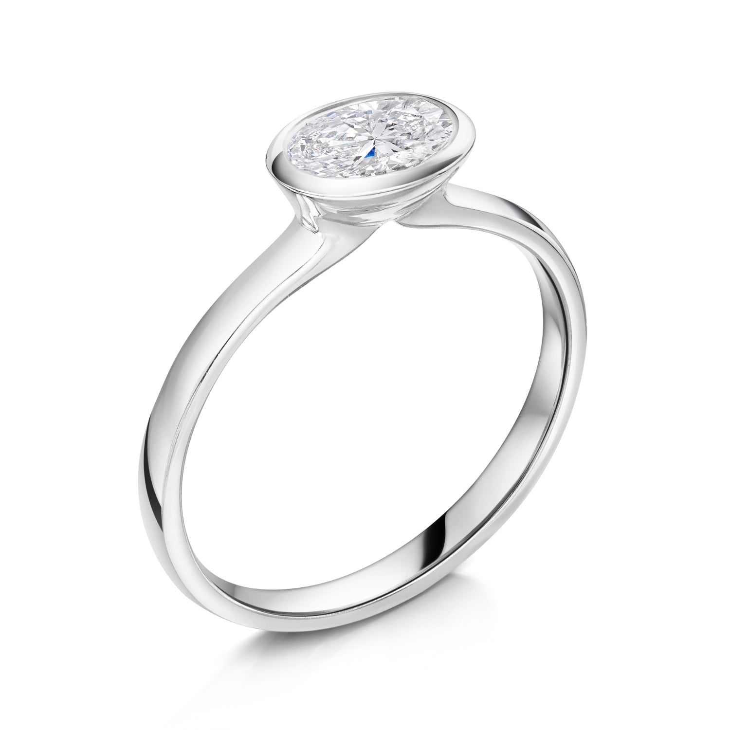 East West bezel set oval diamond solitaire in platinum - angled on a white background 