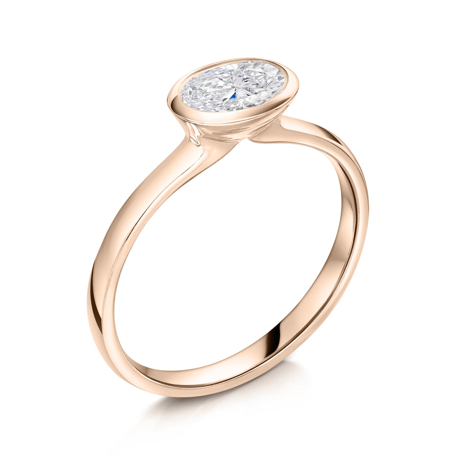 East West bezel set oval diamond solitaire in rose gold - Angled on a white background 