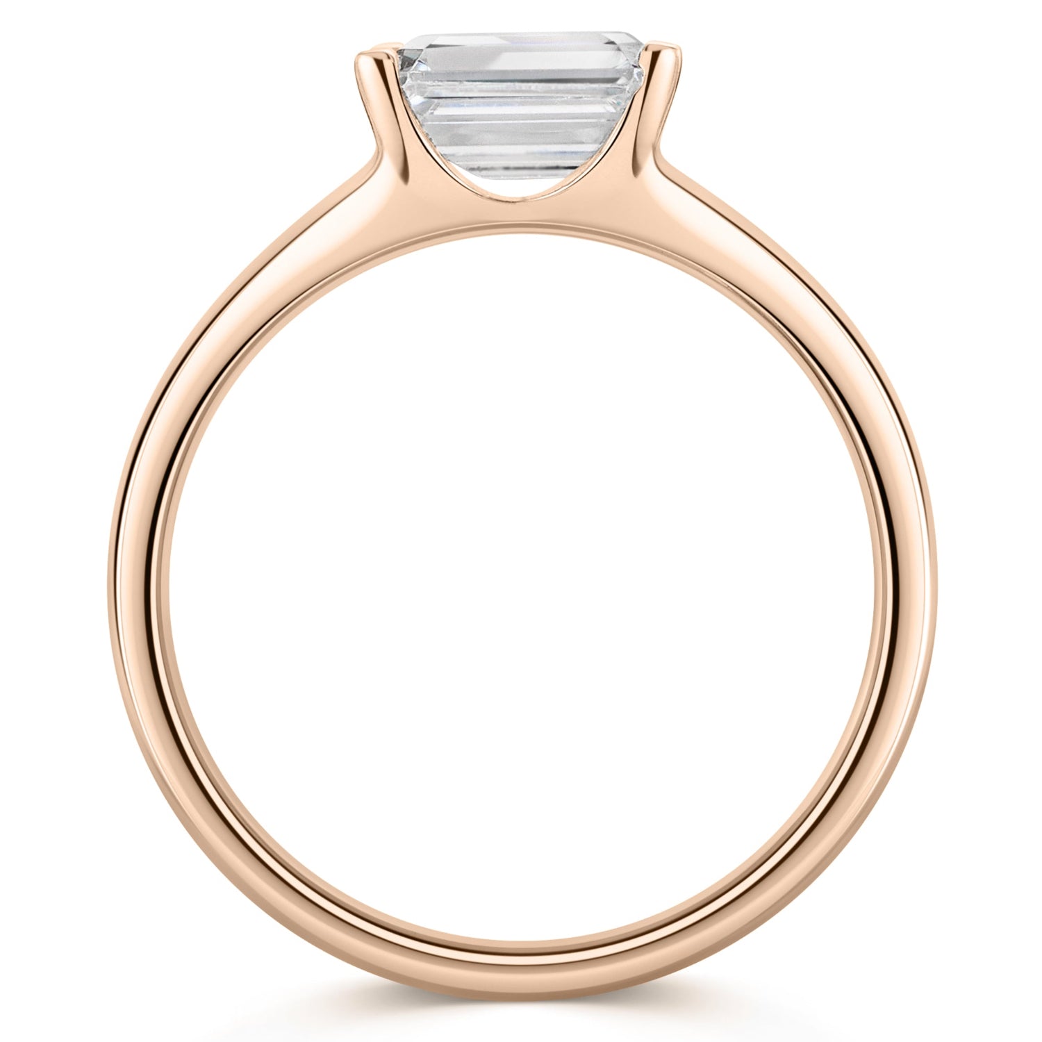 Emerald East West Diamond Engagement Ring in Rose Gold. Side view  on a white background