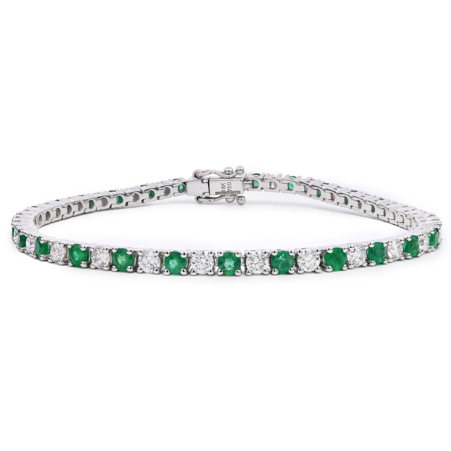 Emerald and Diamond Tennis Bracelet with alternating stones and white background
