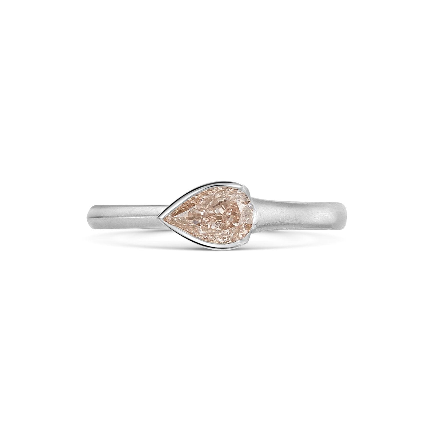Natural Fancy Pink Pear Shaped Diamond Set in a Platinum Band on white background