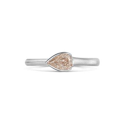 Natural Fancy Pink Pear Shaped Diamond Set in a Platinum Band on white background