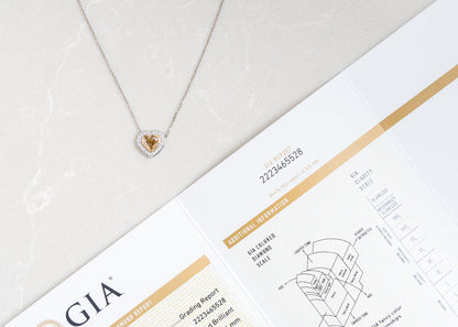 Heart-shaped diamond necklace on a GIA grading report