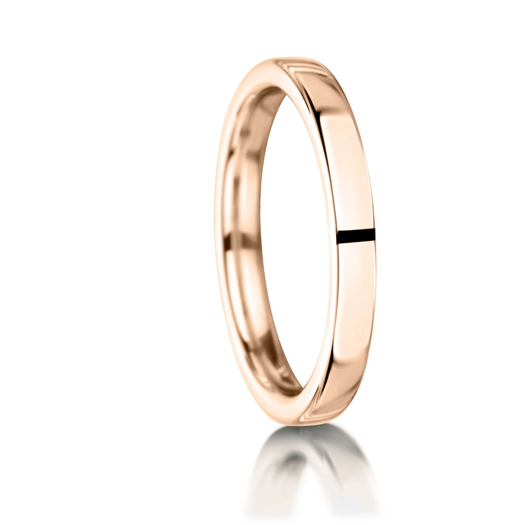 Rose gold ring with a black stripe on a white background