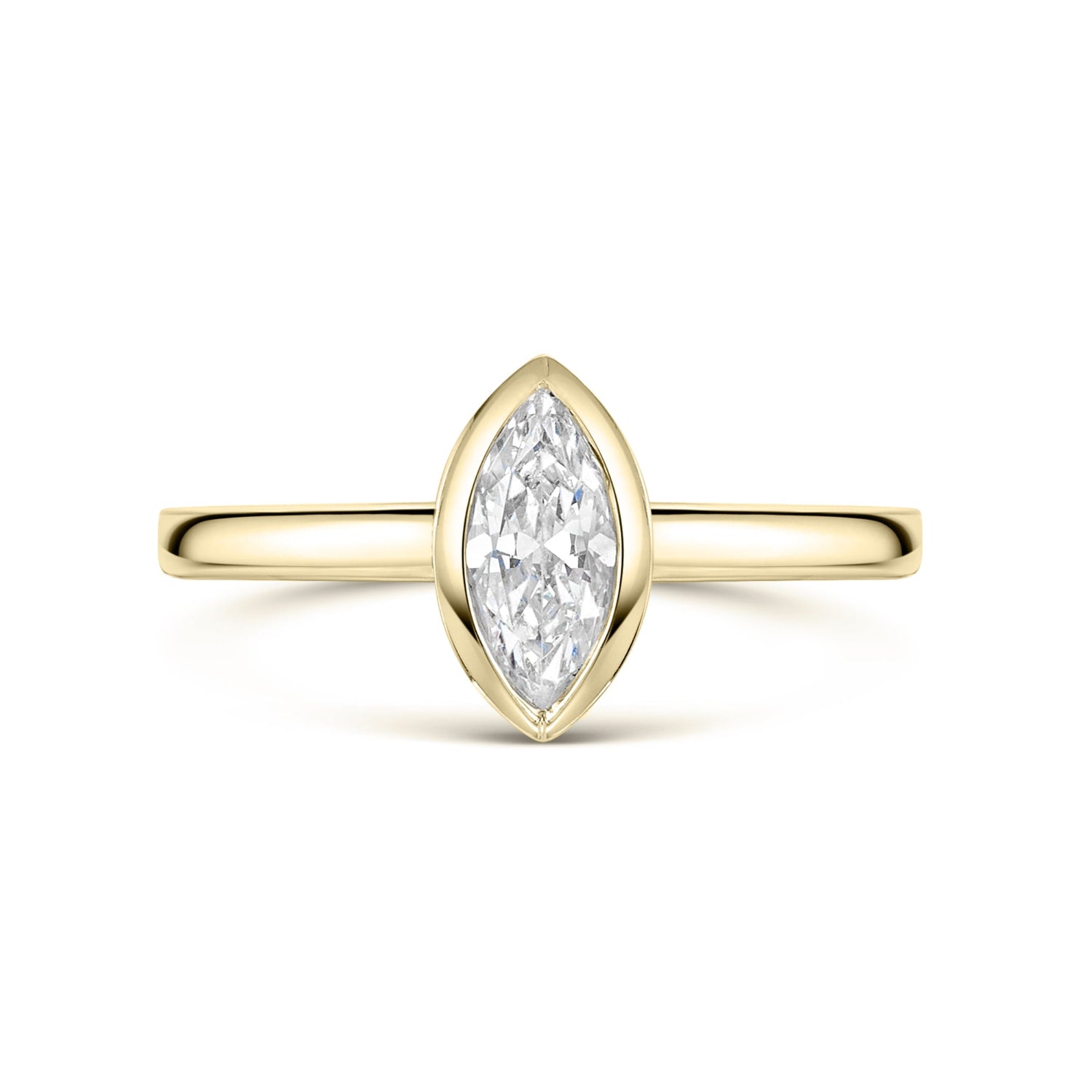 Bezel set Gold ring with a marquise-shaped diamond on a white background