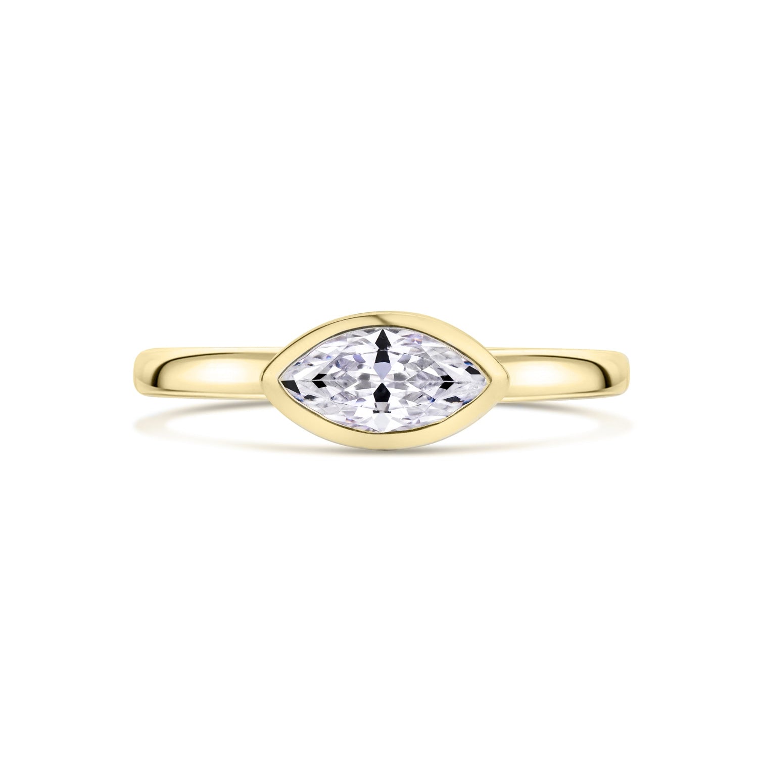 Gold ring with a marquise-shaped diamond set East West on a white background
