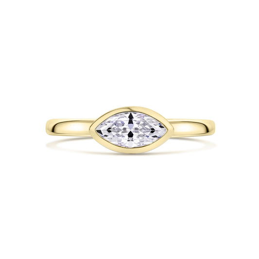 Gold ring with a marquise-shaped diamond set East West on a white background