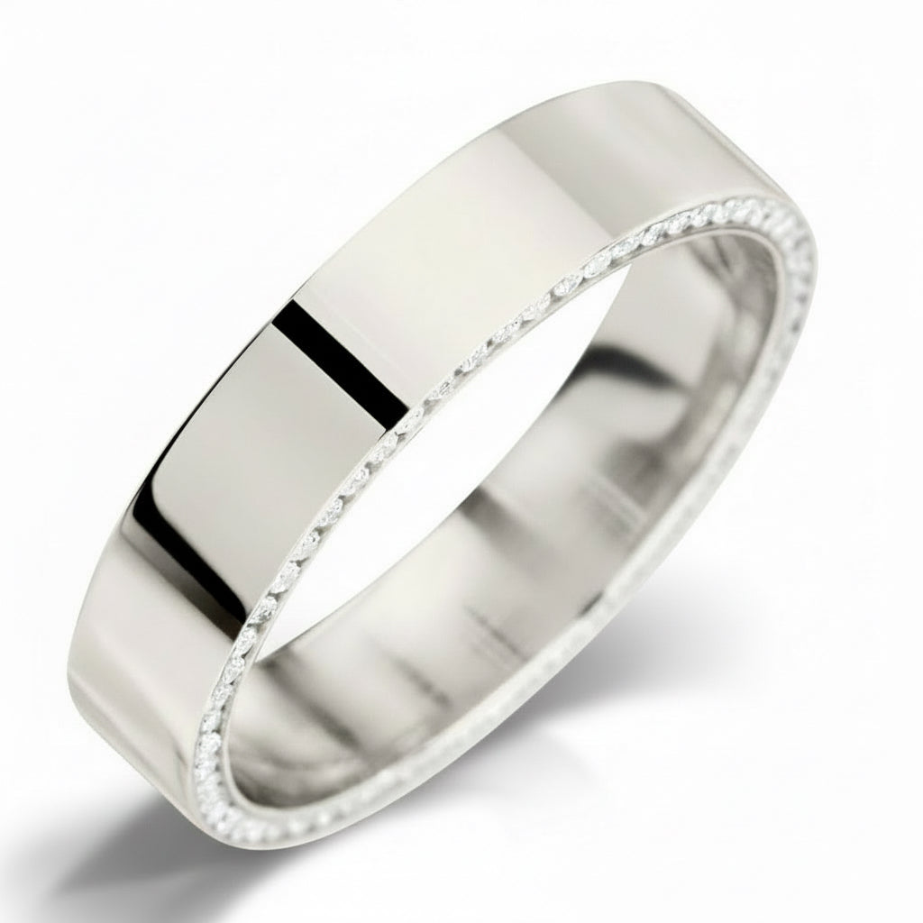 Silver ring with diamonds around the edge and  a smooth finish on a white background