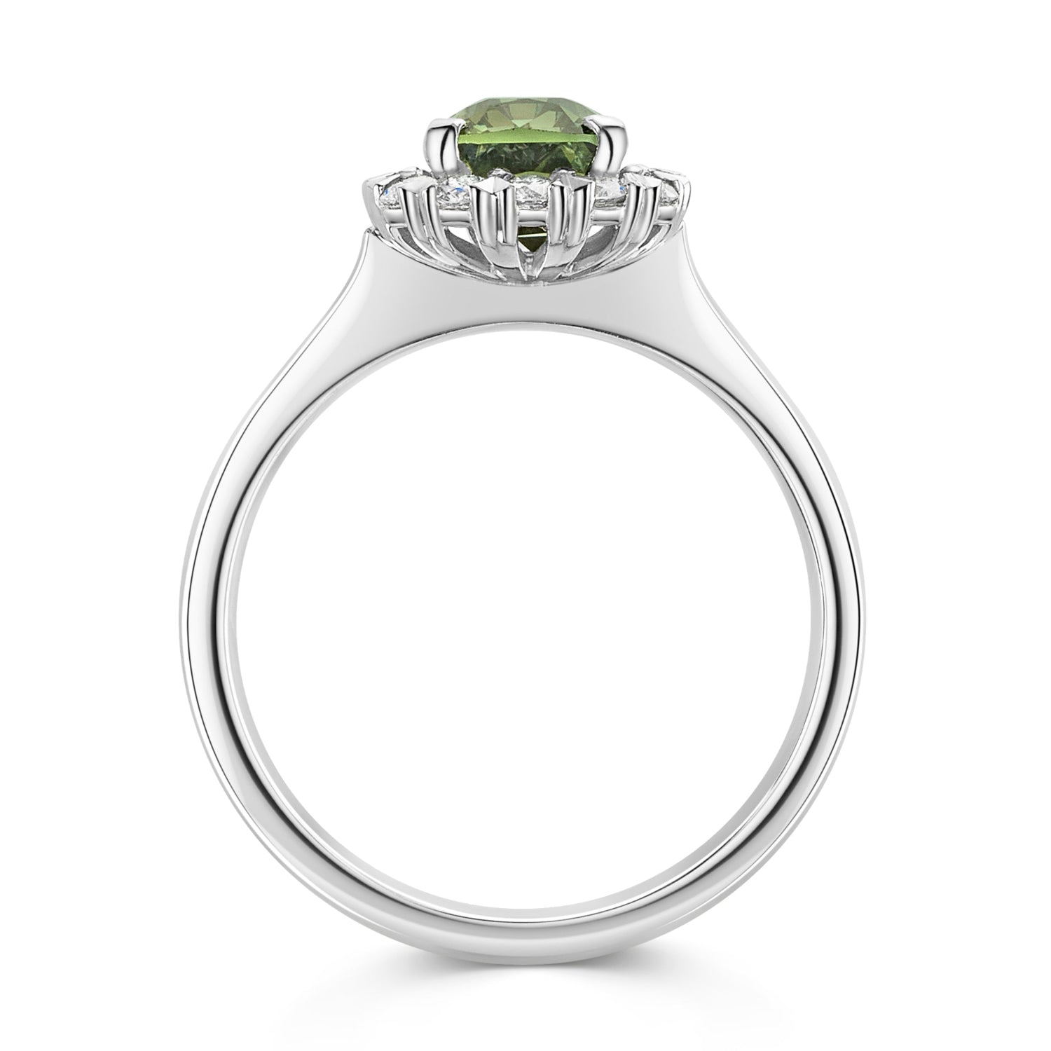 A silver ring featuring a cushion cut green sapphire surrounded by a halo of small white diamonds, set on a polished platinum band against a white background - side view