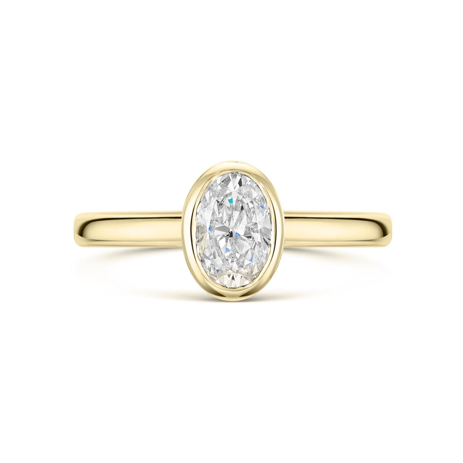 Oval Bezel Set Diamond Solitaire Engagement Ring in yellow gold on white background 