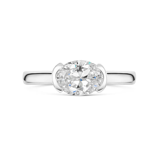 Oval East West Semi Bezel Set Solitaire In platinum on a white background