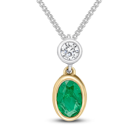 Oval Emerald & Diamond Pendant and chain in white & yellow gold on white background