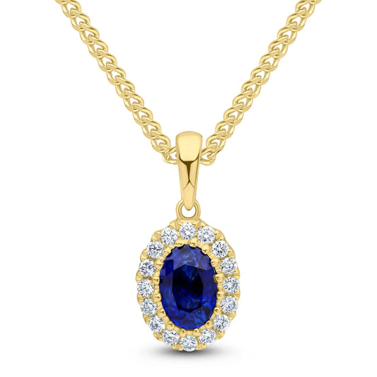 Oval Sapphire & Diamond Cluster Pendant in yellow gold  on a white background