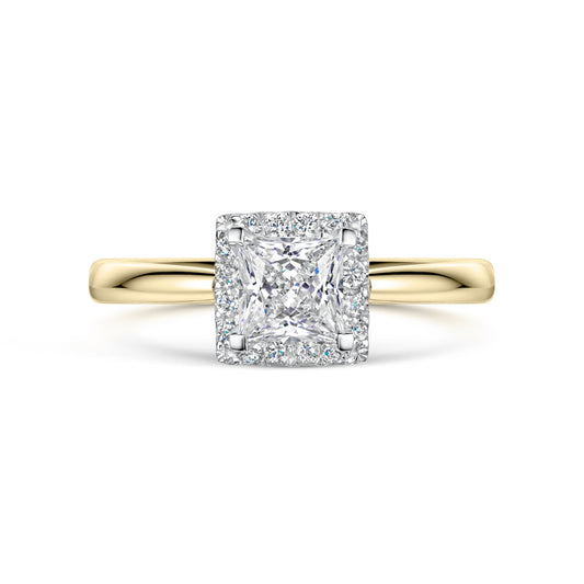 Yellow gold halo ring with a square-cut diamond on a white background