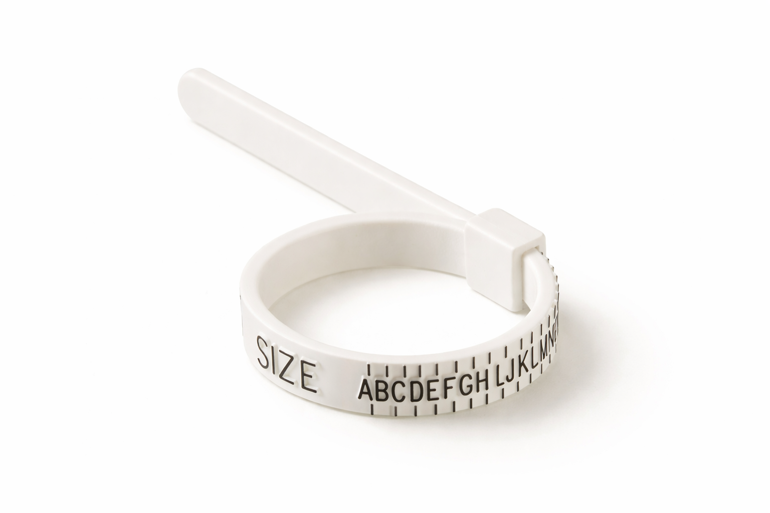 White ring sizer with measurement markings on a white background