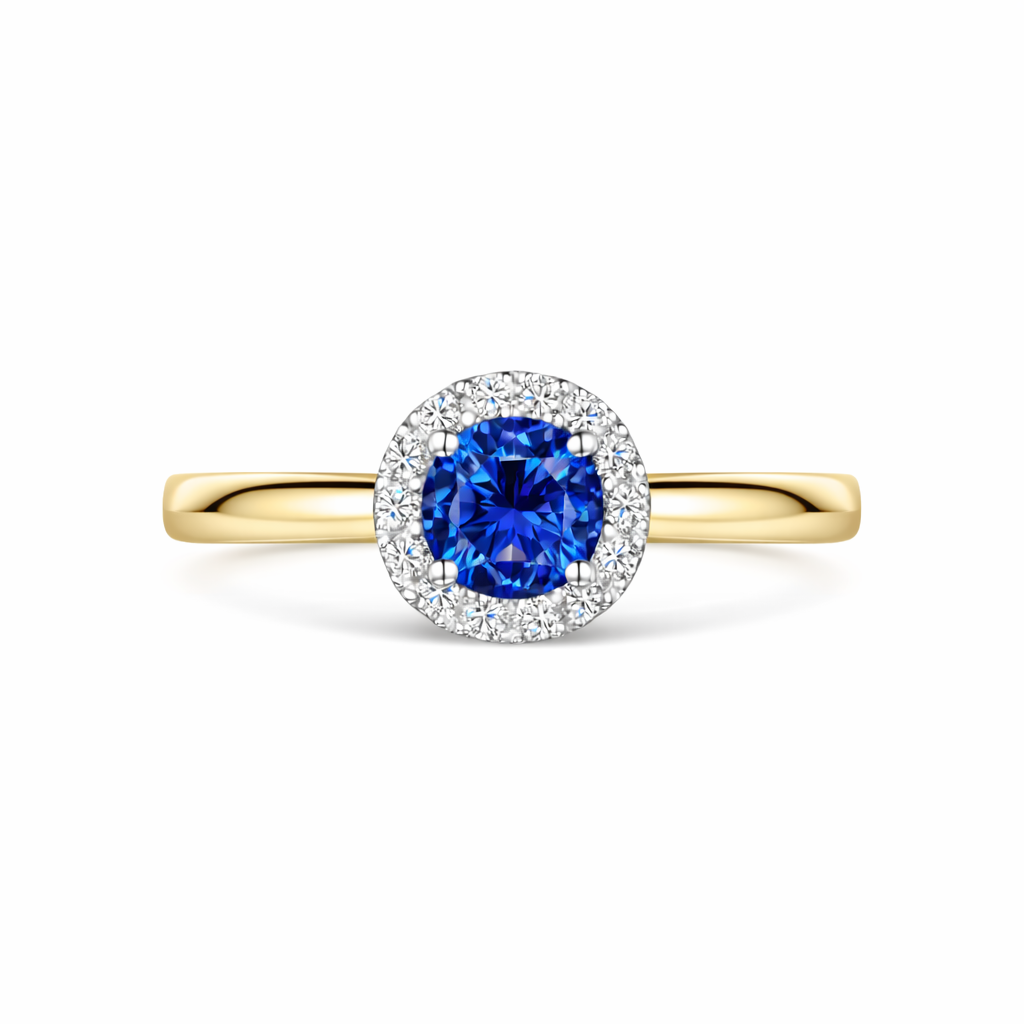 Gold ring with a round blue sapphire and diamond halo on a white background