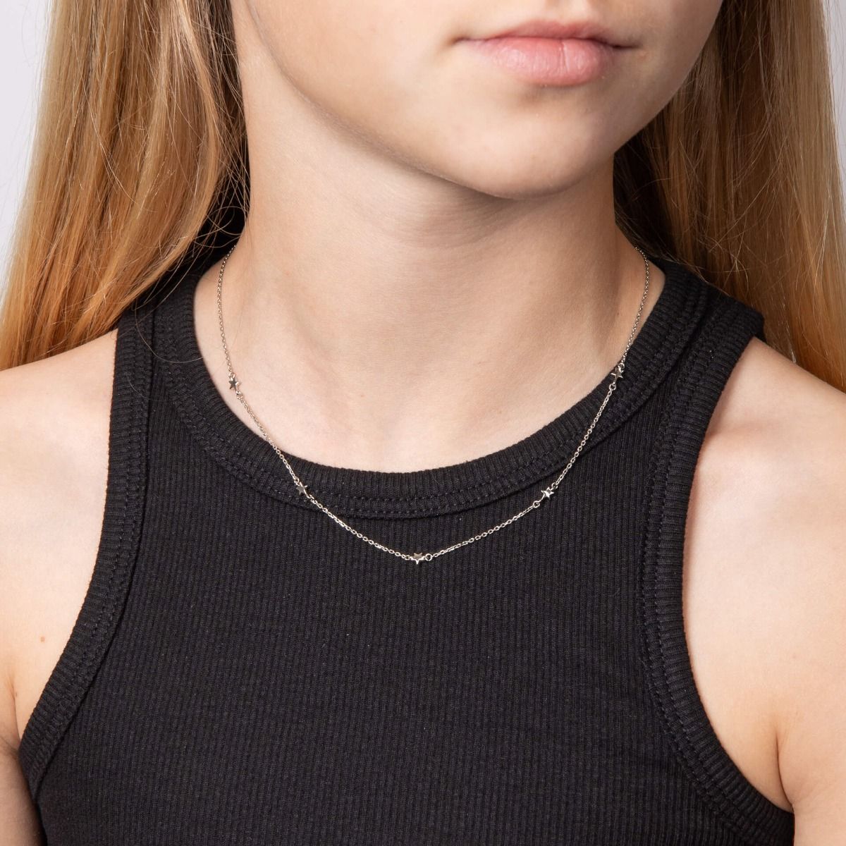 Girls Silver diamond star necklace on model