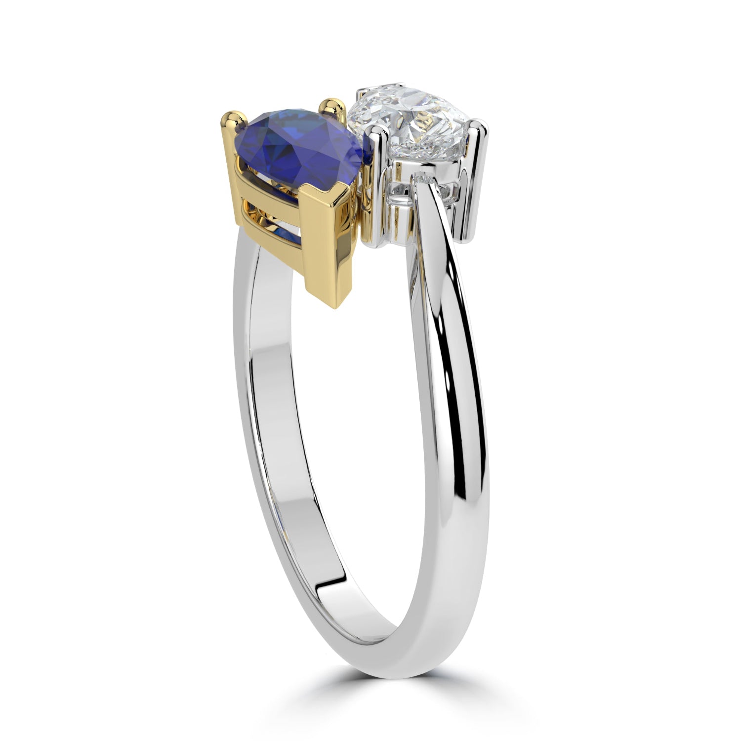 Two-tone ring with a blue gemstone and diamond on a white background
