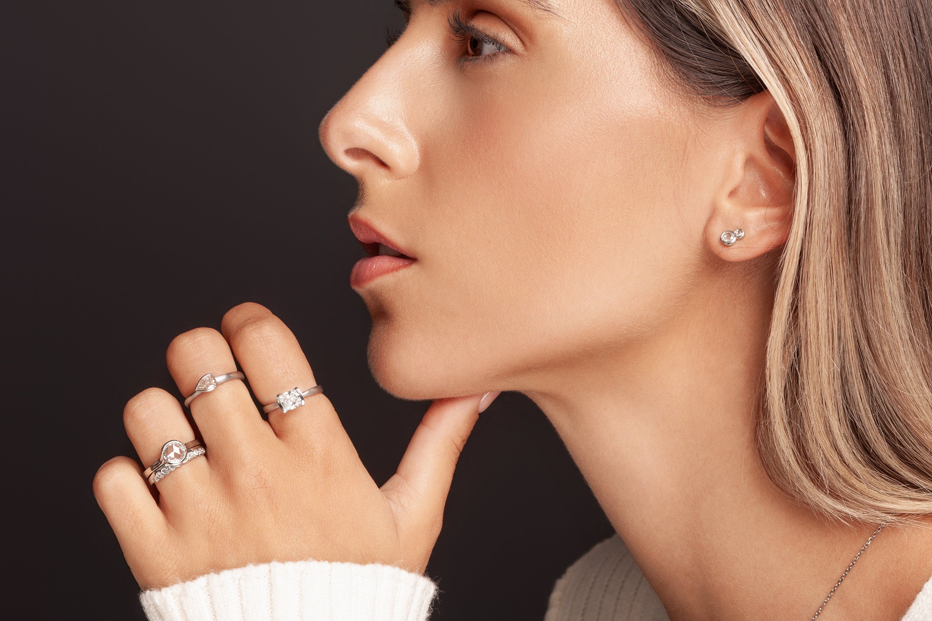 Unique Engagement Ring Specialist - One of a kind diamond rings on model with a dark 