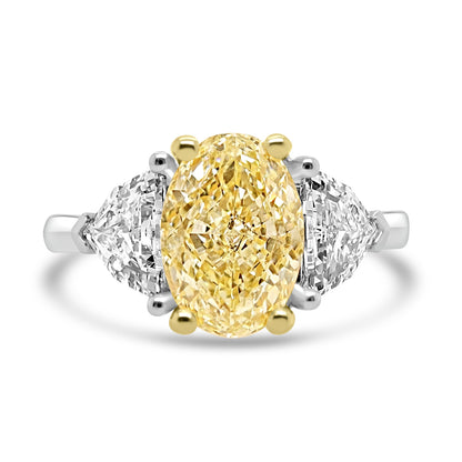 Yellow Diamond Trilogy Ring With Shield Diamond Outers on a white background