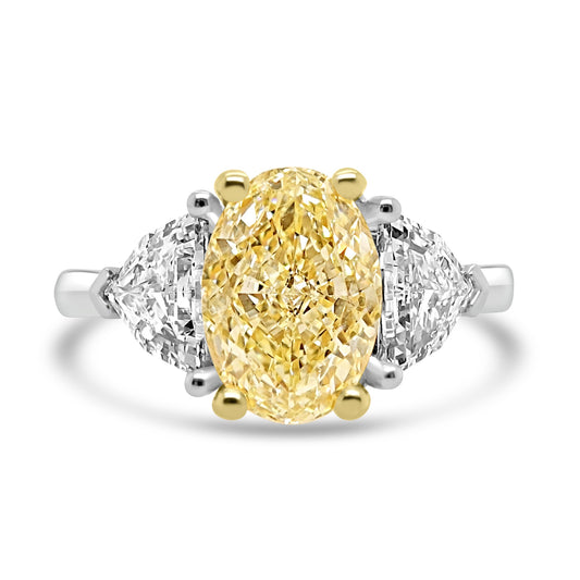 Yellow Diamond Trilogy Ring With Shield Diamond Outers on a white background