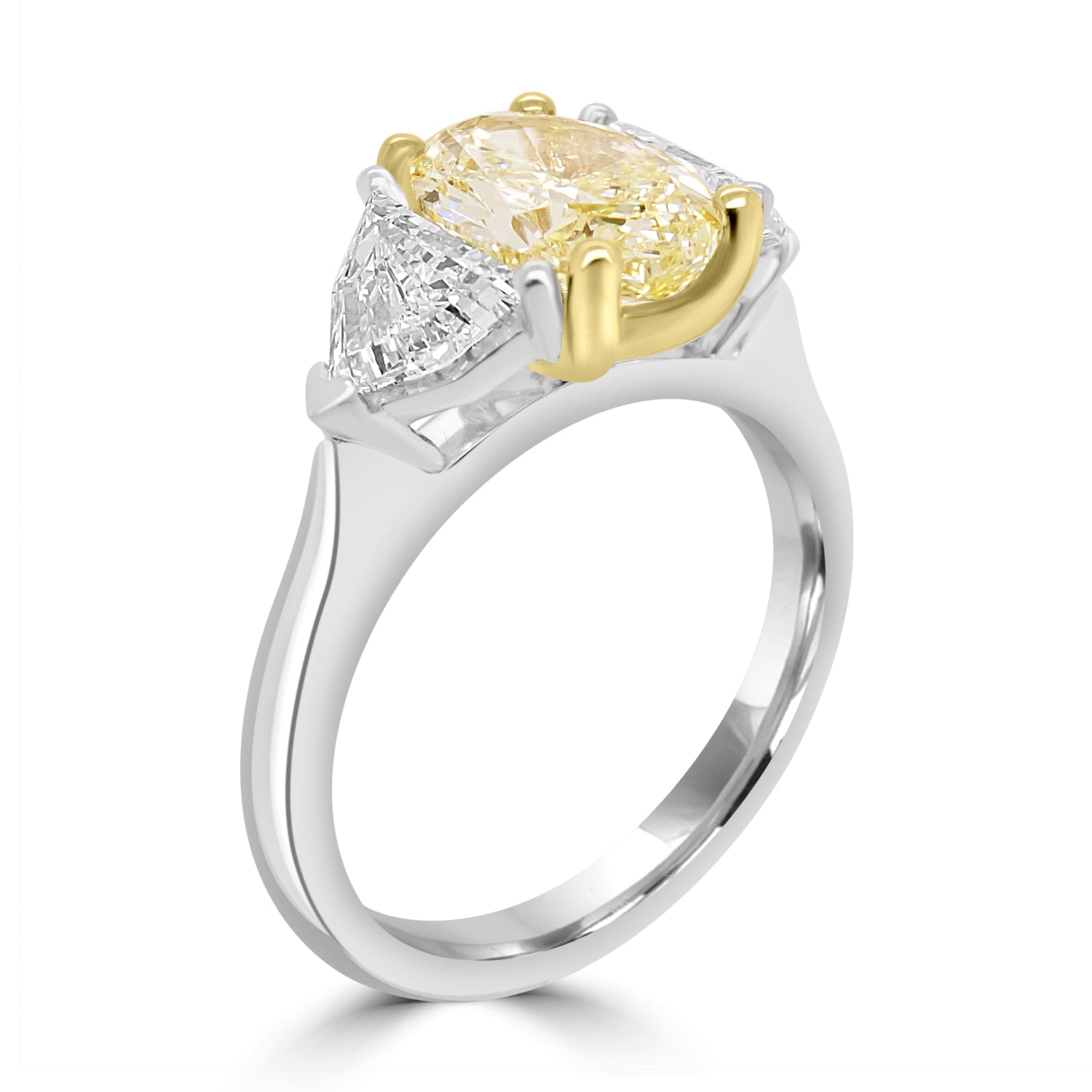 Yellow Diamond Trilogy Ring With Shield Diamond Outers angled on a white background