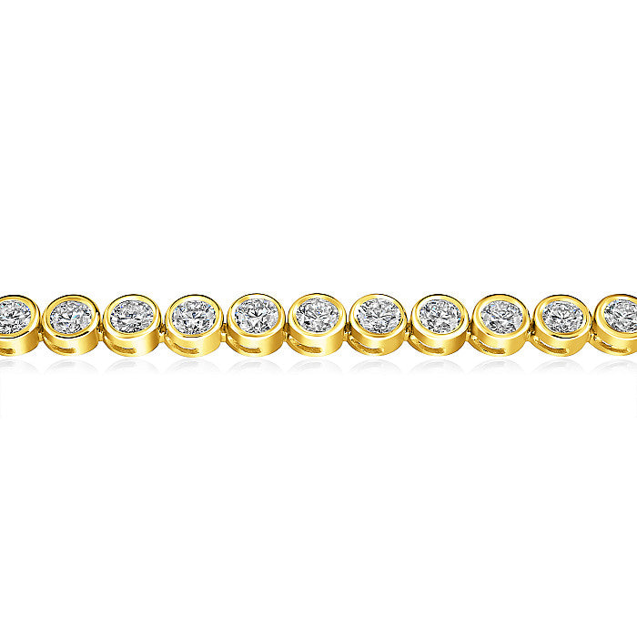 ellow Gold Bezel Tennis Bracelet - close up on a white background