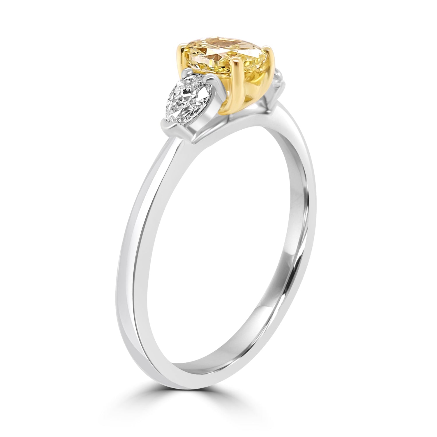 Yellow Oval Diamond Trilogy Engagement Ring with Pear Shaped outer white diamonds on a white background